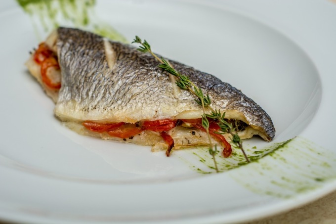 Ricetta filetto branzino con vongole e pomodori