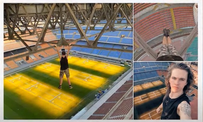 Appeso nel vuoto a 80 metri d’altezza sulle travi di San Siro: la folle “impresa” di Adam Lockwood