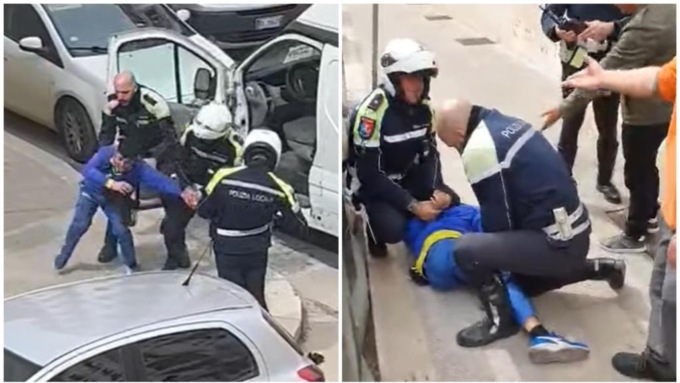 Tre vigili strattonano e bloccano a terra un corriere per un parcheggio: il video